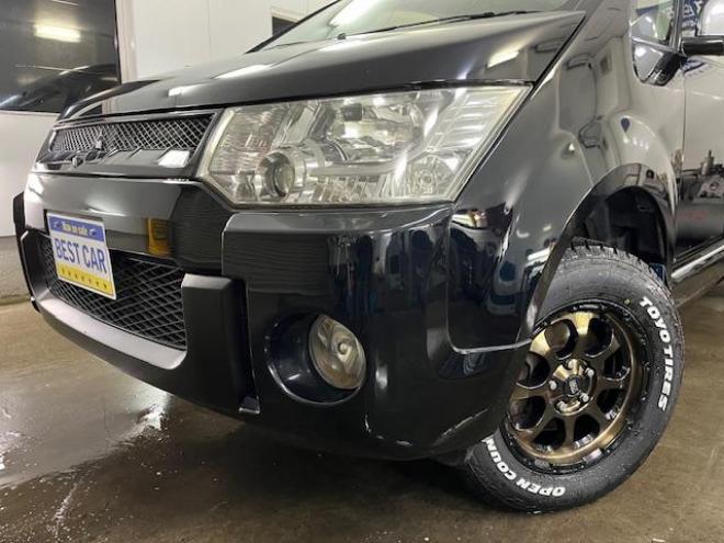 デリカＤ：５　Ｇプレミアム　本州仕入　禁煙車　寒冷地仕様　マッドクロス１６インチＡＷ＋新品ＴＯＹＯオープンカントリーホワイトレター　社外１６ＡＷ＋スタッドレスタイヤ付　新品ＪＡＯＳブラックマッドガード　両側パワースライドドア　パワーバックドア　純正ＨＤＤナビ（地デジ　ＤＶＤ再生　Ｂｌｕｅｔｏｏｔｈ）＋バックカメラ　純正リアフリップダウンモニター　クルーズコントロール　両席シートヒーター　パワーシート　スマートキー　パドルシフト　横滑り防止装置　盗難防止装置　リアヒーター　ＨＩＤ　ＥＴＣ 4WD 2400 5Dr