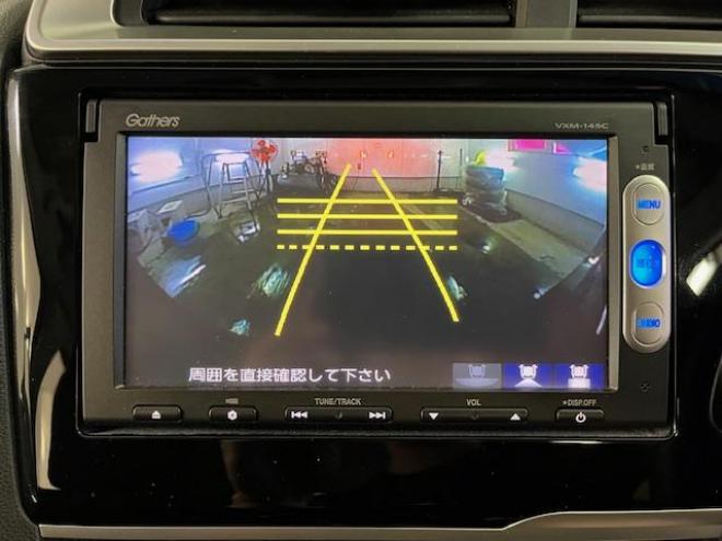 フィット１３Ｇ　Ｆパッケージ　本州仕入　禁煙車　ＷＡＫＯＳバリアスコーティング済　社外１５インチＡＷ　１５インチホイール＋スタッドレスタイヤ付　純正ギャザースナビ＋バックカメラ　ＰＵＳＨスタート　スマートキー　ミラーヒーター　フロントガラス熱線　アイドリングストップ　盗難防止装置　横滑り防止装置 4WD 1300 5Dr