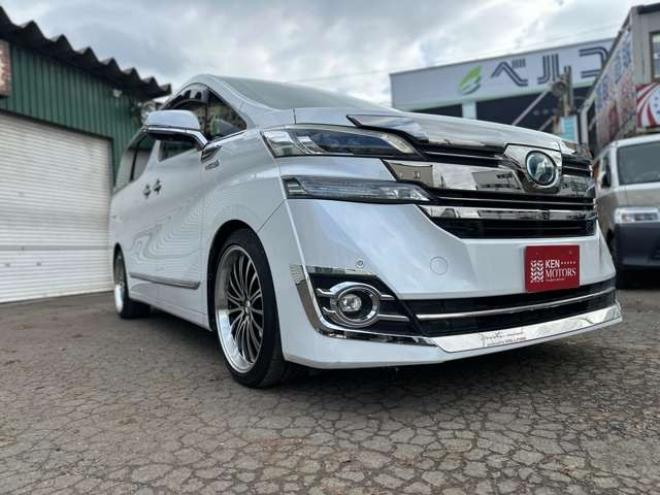 ヴェルファイアハイブリッド 2.5 V E-Four 4WD　社外アルミ　オートミラー　ETC　ドライブレコーダー　ローダウン　ワンオーナー　両側電動スライドドア　パワステ　パワーウィンドウ　ベージュ革シート　純正ナビ　バックカメラ　ABS　キーレスエントリー 2500