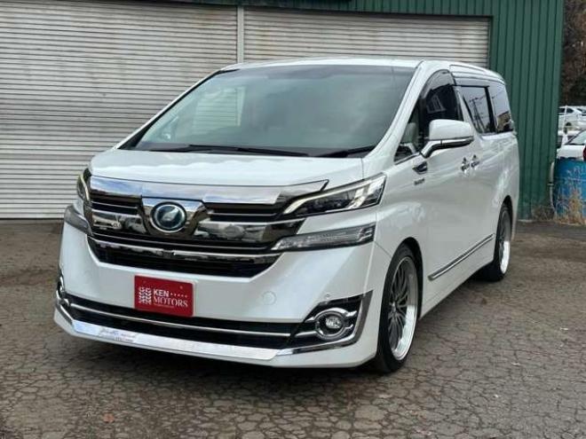 ヴェルファイアハイブリッド 2.5 V E-Four 4WD　社外アルミ　オートミラー　ETC　ドライブレコーダー　ローダウン　ワンオーナー　両側電動スライドドア　パワステ　パワーウィンドウ　ベージュ革シート　純正ナビ　バックカメラ　ABS　キーレスエントリー 2500