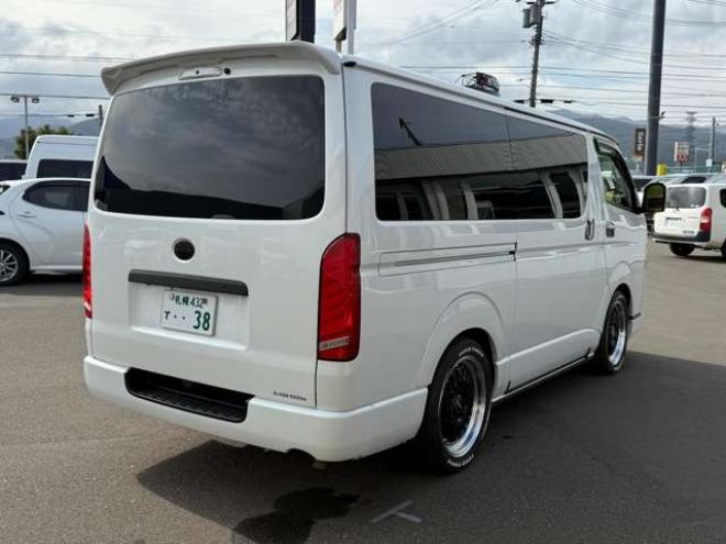 ハイエースバン2.8ダークプライムIIマルチロールトランスポータータイプIロングディーゼルターボ4WD　寒冷地仕様　ワンオーナー　ESSEX　ENCM18インチAW　ESSEXフロントリップスポイラー　ローダウン　パワースライドドア　LEDテール　415COBRAシートカバー&ローフォルムフェンダー&ステアリング 2800