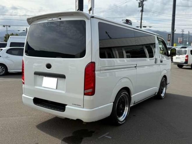 ハイエースバン2.8ダークプライムIIマルチロールトランスポータータイプIロングディーゼルターボ4WD　寒冷地仕様　ワンオーナー　ESSEX　ENCM18インチAW　ESSEXフロントリップスポイラー　ローダウン　パワースライドドア　LEDテール　415COBRAシートカバー&ローフォルムフェンダー&ステアリング 2800