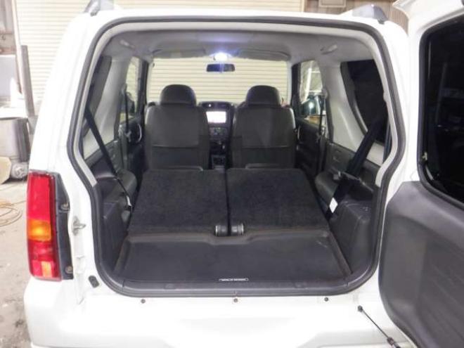 ジムニーワイルドウインド 4WD　本州仕入・ナビ・TV・Bカメラ・専用レザーシート・ETC・キーレス・シートヒーター・フォグランプ・ターボ・純正AW・電動格納ミラー・ミラーヒーター・ルーフレール 660