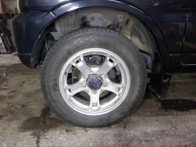 ジムニーワイルドウインド 4WD　本州仕入・ナビ・フルセグTV・キーレス・フォグランプ・シートヒーター・ミラーヒーター・ルーフレール・ターボ・社外AW・ライトレベライザー・電動格納ミラー・DVD再生・JAOSマッドガード 660