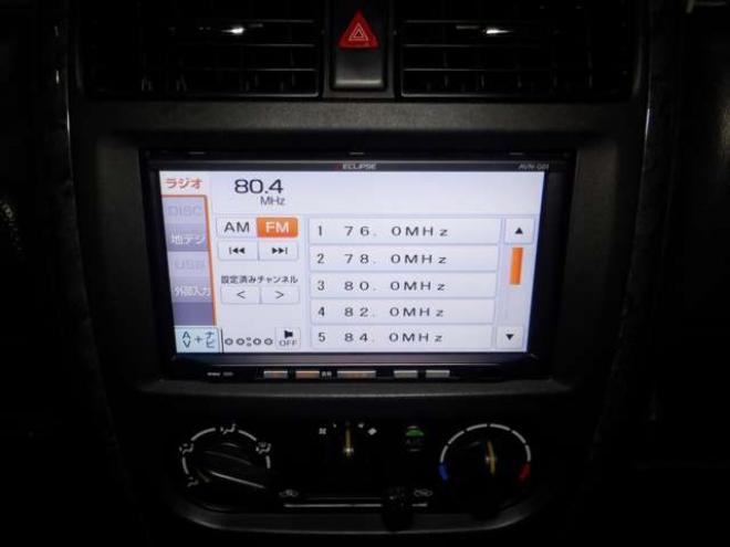 ジムニーワイルドウインド 4WD　本州仕入・ナビ・フルセグTV・キーレス・フォグランプ・シートヒーター・ミラーヒーター・ルーフレール・ターボ・社外AW・ライトレベライザー・電動格納ミラー・DVD再生・JAOSマッドガード 660