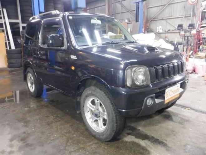 ジムニーワイルドウインド 4WD　本州仕入・ナビ・フルセグTV・キーレス・フォグランプ・シートヒーター・ミラーヒーター・ルーフレール・ターボ・社外AW・ライトレベライザー・電動格納ミラー・DVD再生・JAOSマッドガード 660