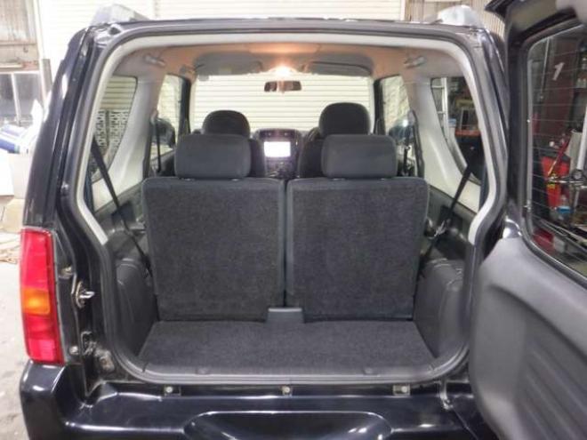 ジムニーワイルドウインド 4WD　本州仕入・ナビ・フルセグTV・キーレス・フォグランプ・シートヒーター・ミラーヒーター・ルーフレール・ターボ・社外AW・ライトレベライザー・電動格納ミラー・DVD再生・JAOSマッドガード 660