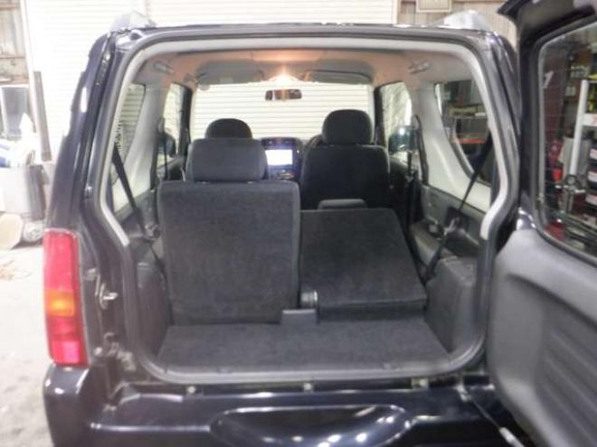 ジムニーワイルドウインド 4WD　本州仕入・ナビ・フルセグTV・キーレス・フォグランプ・シートヒーター・ミラーヒーター・ルーフレール・ターボ・社外AW・ライトレベライザー・電動格納ミラー・DVD再生・JAOSマッドガード 660