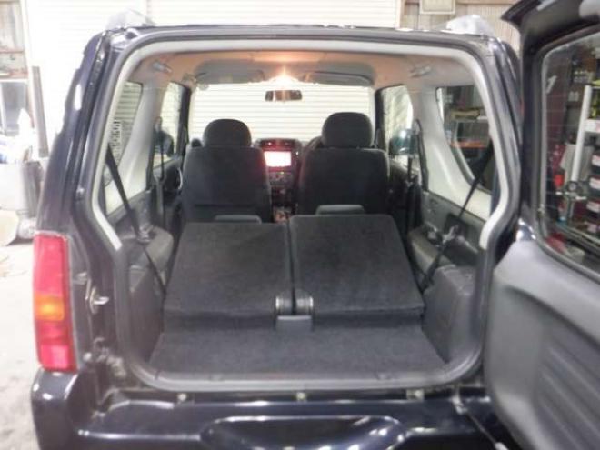 ジムニーワイルドウインド 4WD　本州仕入・ナビ・フルセグTV・キーレス・フォグランプ・シートヒーター・ミラーヒーター・ルーフレール・ターボ・社外AW・ライトレベライザー・電動格納ミラー・DVD再生・JAOSマッドガード 660
