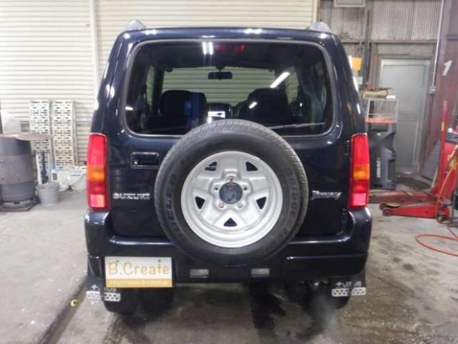 ジムニーワイルドウインド 4WD　本州仕入・ナビ・フルセグTV・キーレス・フォグランプ・シートヒーター・ミラーヒーター・ルーフレール・ターボ・社外AW・ライトレベライザー・電動格納ミラー・DVD再生・JAOSマッドガード 660