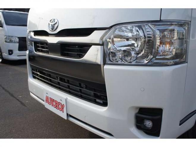 ハイエースバン2.8 スーパーGL ダークプライム S ロングボディ ディーゼルターボ 4WD　ダークプライムS　登録済未使用車　4WD　両側パワースライドドア　デジタルインナーミラー　全方位カメラ　バックカメラ　寒冷地仕様　プッシュスタート　スマートキー　415COBRAフラットベッドキット 登録済未使用車 2800