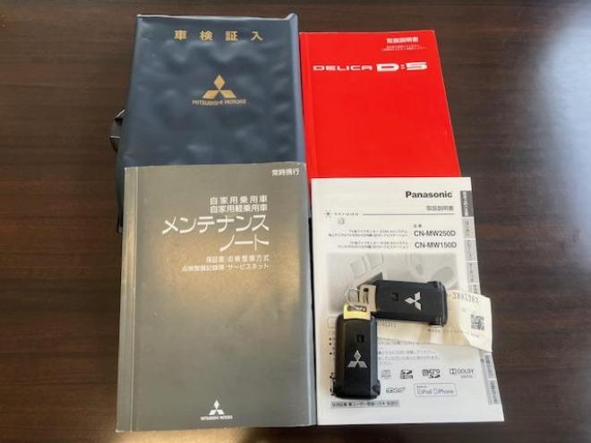 デリカＤ：５　Ｇパワーパッケージ　本州仕入　寒冷地仕様　禁煙車　両側パワースライドドア　エクストリーム１６インチＡＷ＋ＮＥＯＬＩＮホワイトレター　新品ＪＡＯＳブラックマッドガード　アルパイン製リアグリップダウンモニター　ストラーダナビ 4WD 2400 5Dr