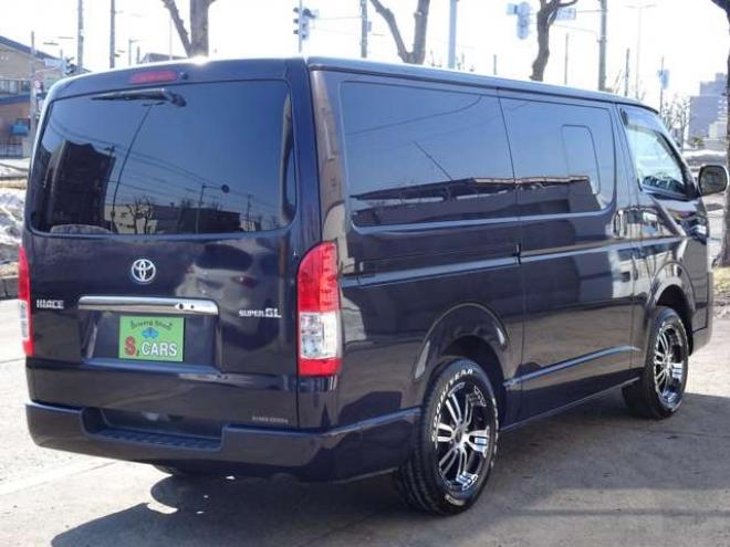 ハイエースバン3.0 スーパーGL ダークプライム ロングボディ ディーゼルターボ 4WD　本州車　4WD　3.0ディーゼルターボ　ダークプライム　新品タイミングベルト/ウォーターポンプ交換込　DELF&NASCARホワイトレタータイヤ　バックカメラ　本革巻黒木目ハンドル　メッキグリル　LEDヘッドライト ETC 3000