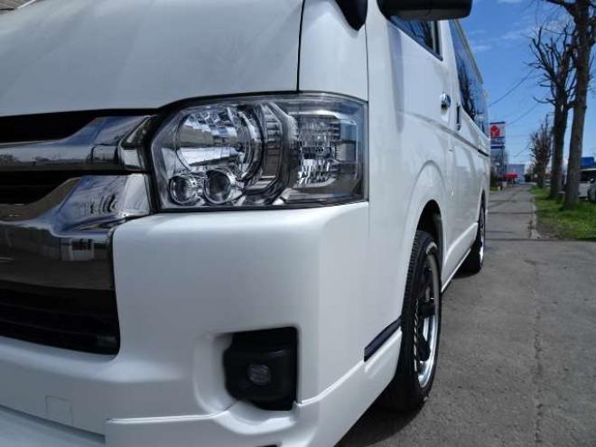 ハイエースバン2.7 スーパーGL ダークプライム ワイド ミドルルーフ ロングボディ 4WD　本州車　保証1年/走行距離無制限 4WD　後期仕様　モデリスタエアロ　両側パワースライドドア　舞杏KBレーシング2アルミホイール　ALPINE製ナビ　地デジ　バックカメラ　現行型ドアミラー　スマートキー ベットキット 2700
