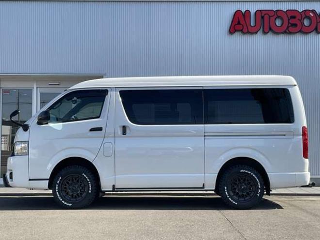 ハイエースバン2.7 スーパーGL ダークプライムII ワイド ミドルルーフ ロングボディ 4WD　TOYOオープンカントリーR/T215/65R16　ナイトロパワーM29スティンガー16インチAW　ワンオーナー　社外ナビTV　両側パワースライドドア　ETC　Pivot製クルコン　Tom's製テールライト　JAOS リヤスキッドバー 2700