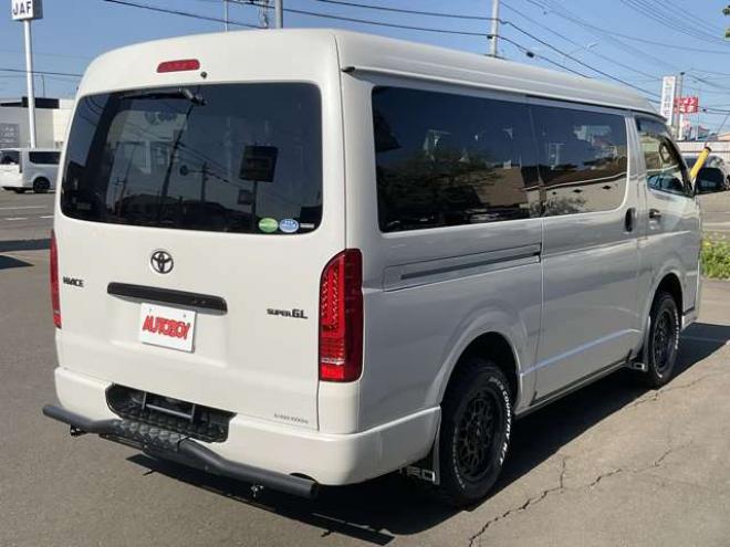 ハイエースバン2.7 スーパーGL ダークプライムII ワイド ミドルルーフ ロングボディ 4WD　TOYOオープンカントリーR/Tタイヤ　ナイトロパワーM29スティンガー16インチAW　ワンオーナー　両側パワースライドドア　ETC　Pivot製オートクルーズ付きスロコン　Tom's製テールライト　JAOS リヤスキッドバー 2700