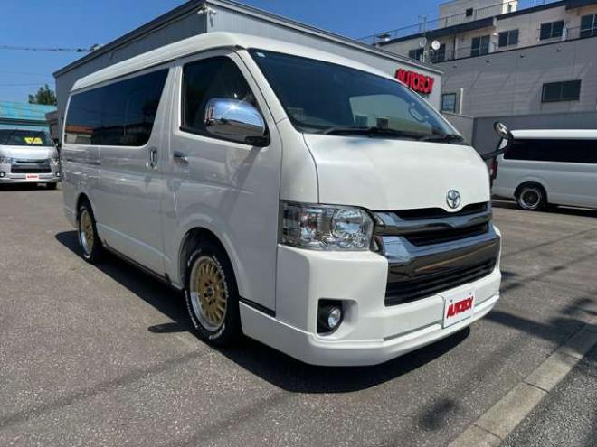 ハイエースバン2.7 スーパーGL ダークプライム ワイド ミドルルーフ ロングボディ 4WD　Pスタート スマートキー 両側スライドドア　OPLEDヘッドライト Fフォグ ハーフレザーシート AC100V ベンチシート　ベッドキット リアクーラー ヒーター ステアリングスイッチ ディスプレイオーディオ　Bluetooth 2700