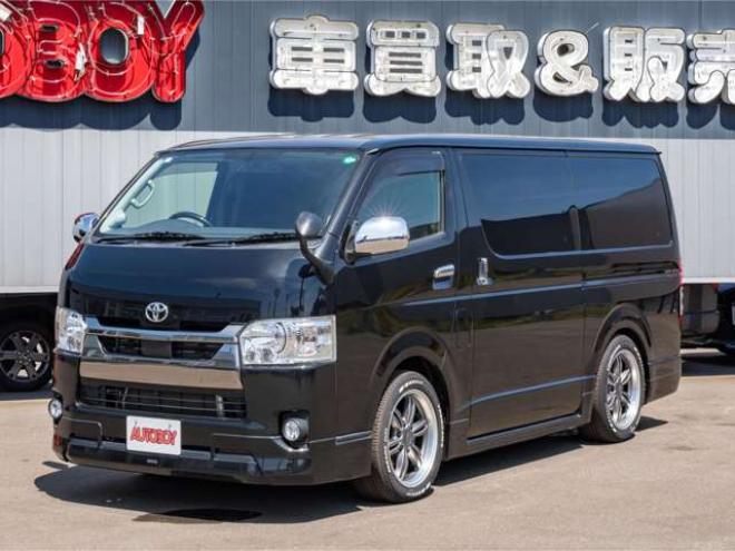 ハイエースバン2.8ダークプライム マルチロールトランスポータータイプIIロング ディーゼルターボ4WD　モデリスタフルエアロ・415COBRAバッドラッカー18インチAW・純正SDナビTV・Bカメラ・両側パワスラ・LEDライト・スマキー・AC100V・ベッドキット・エンスタ 2800