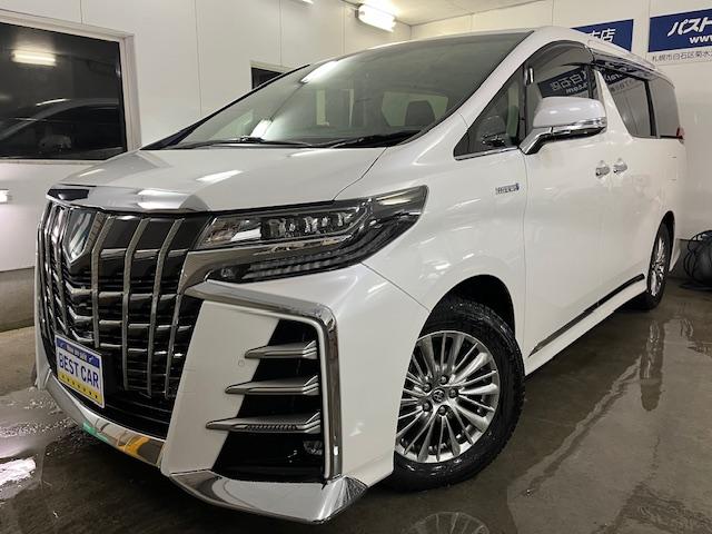 アルファードハイブリッドＳＲ　ワンオーナー　寒冷地仕様　禁煙車　ＪＢＬサウンド　リアエンターテイメント　プリクラッシュ　レーダークルーズ　純正１７インチＡＷ　純正１７ＡＷ＋スタッドレスタイヤ付　純正ナビ（フルセグ地デジ　Ｂｌｕｅｔｏｏｔｈ）＋バックカメラ　全方位パノラミックビューモニター　純正１２インチリアフリップダウンモニター　デジタルインナーミラー　両側パワースライドドア　パワーバックドア　純正ブラックレザーシート　電動オットマン　三眼ＬＥＤヘッドライト　前後ドライブレコーダー　純正エンジンスターター　両席シートヒーター＆ク